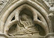 Panel 18:06 - Seated figure with long hair, reading from a scroll